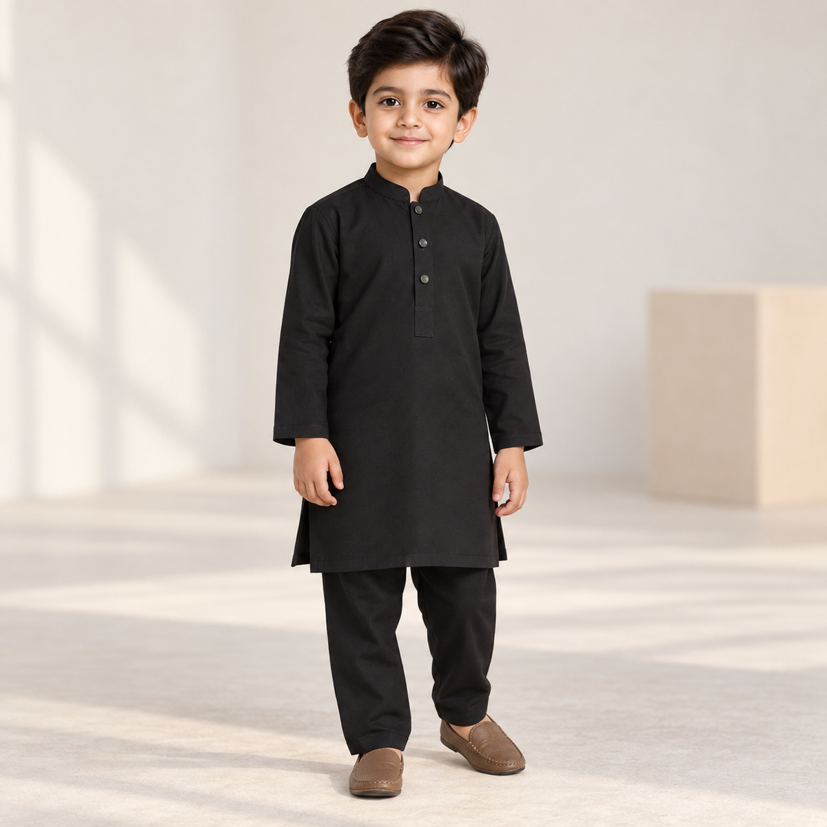 Boys Black Kurta & Trouser Set worn by an ELADENS Kids model