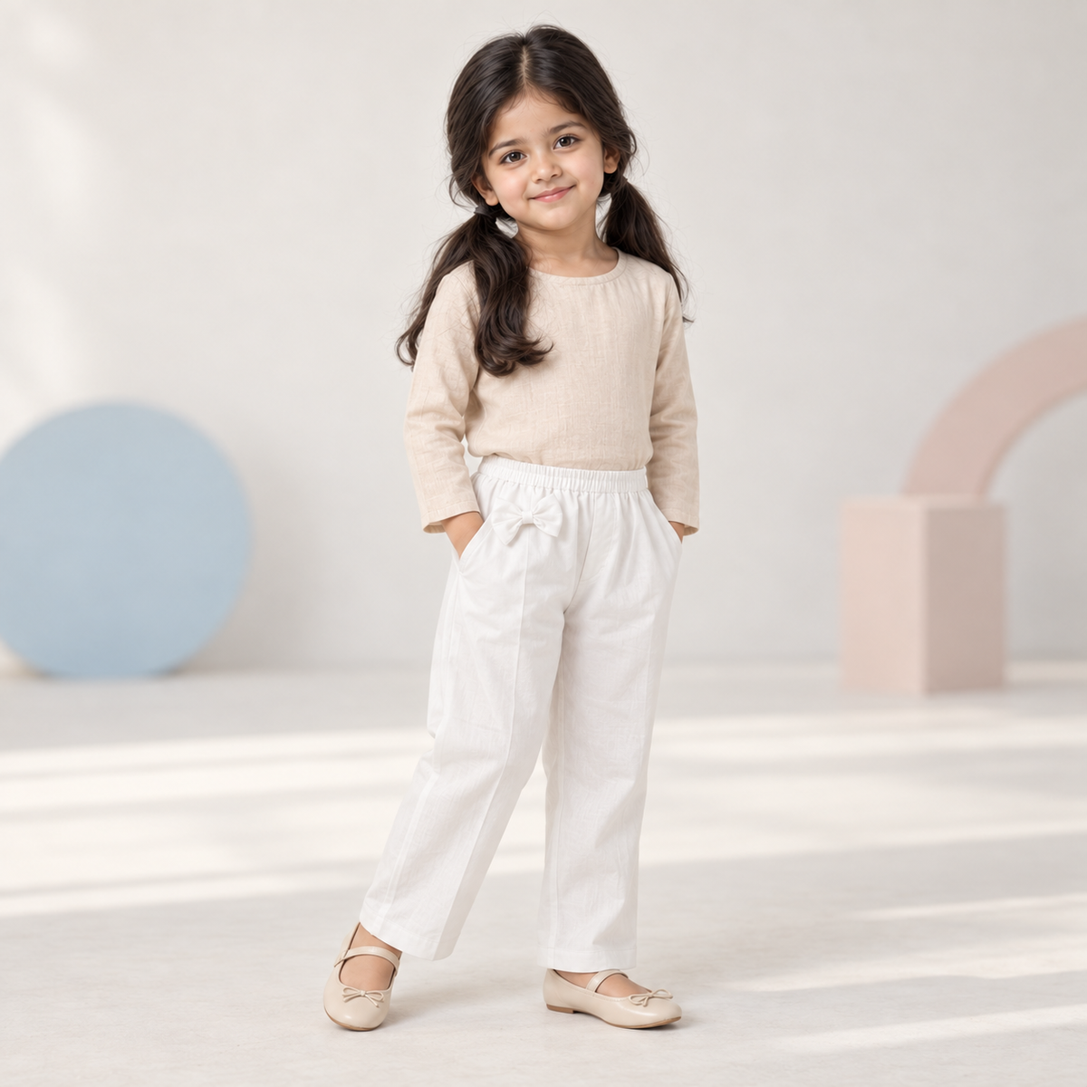 Girls White Bow Trouser worn by an ELADENS Kids model